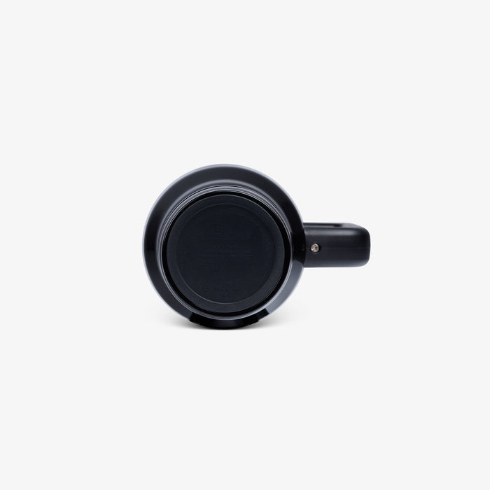 Angle View | 32 Oz Flip ‘n’ Sip Travel Mug::Skeleton Glow::Built-in coaster