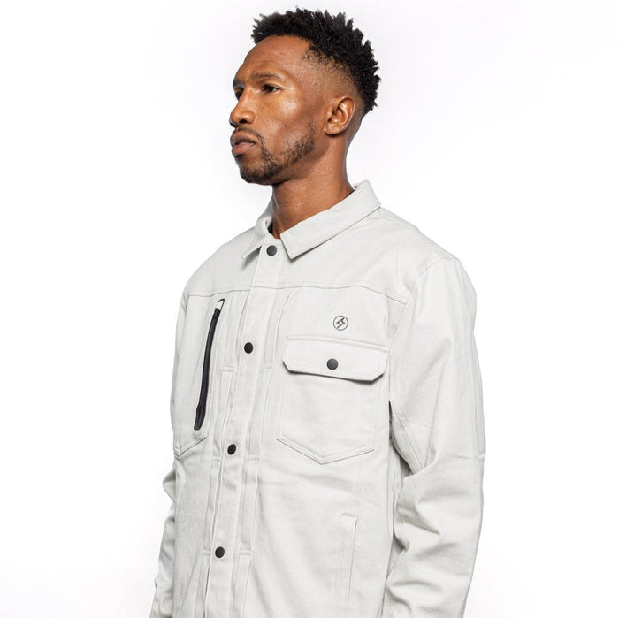 Side view of Male model wearing Anvil Chore Jacket in chalk colorway. @color_chalk