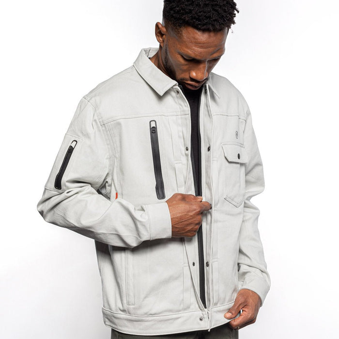Side view of Male model zipping Anvil Chore Jacket in chalk colorway. @color_chalk