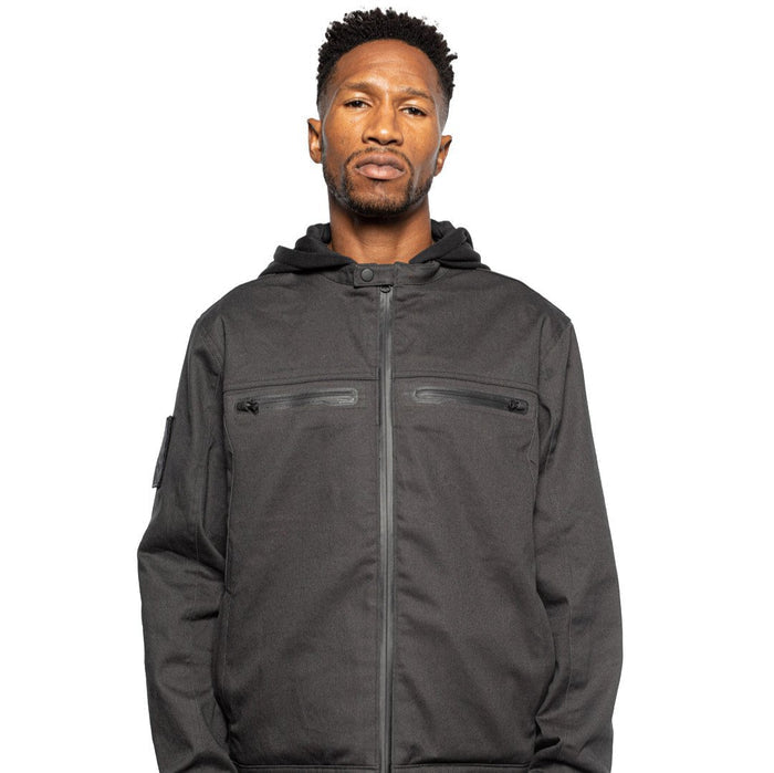 Front view of Male model wearing Chisel Hooded Jacket in gravel colorway. @color_gravel
