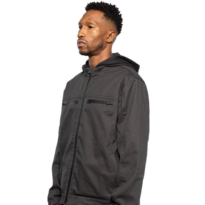 Side view of Male model wearing Chisel Hooded Jacket in gravel colorway. @color_gravel