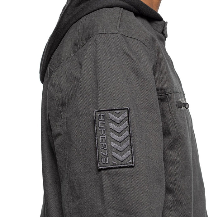 Side sleeve detail view of Male model wearing Chisel Hooded Jacket in gravel colorway. @color_gravel