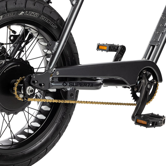 Gold chain on bike with a white background. @color_gold