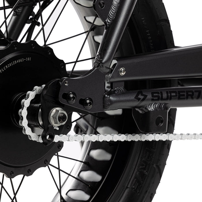 Close up shot of white chain on bike with white background. @color_white