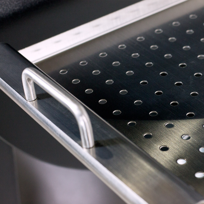 Stainless steel Deluxe Side Shelf for Pit Boss Grills 700 & 820 models, featuring a perforated design and sturdy handle.