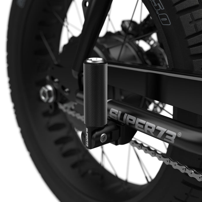 Folding peg with aluminum cap on bike. @color_aluminum