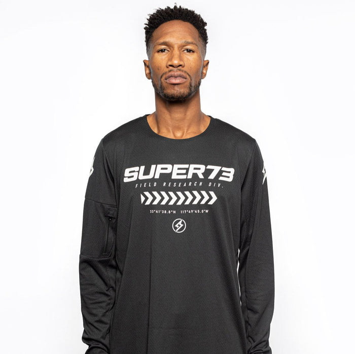 Male model front view of black Premium long sleeve athletic moto hoon jersey. @color_black