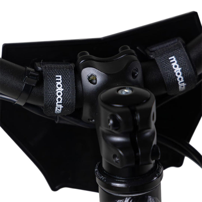 Back side view of the MotoCutz Micro Race Plate in Black installed on handlebars