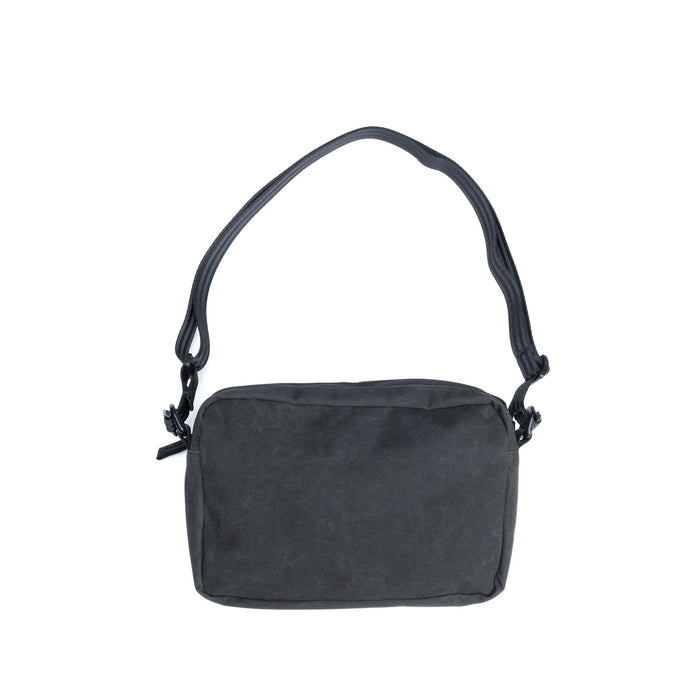 The back of the Pac Shoulder 3L Pouch in Black Canvas Leather #color_black canvas leather