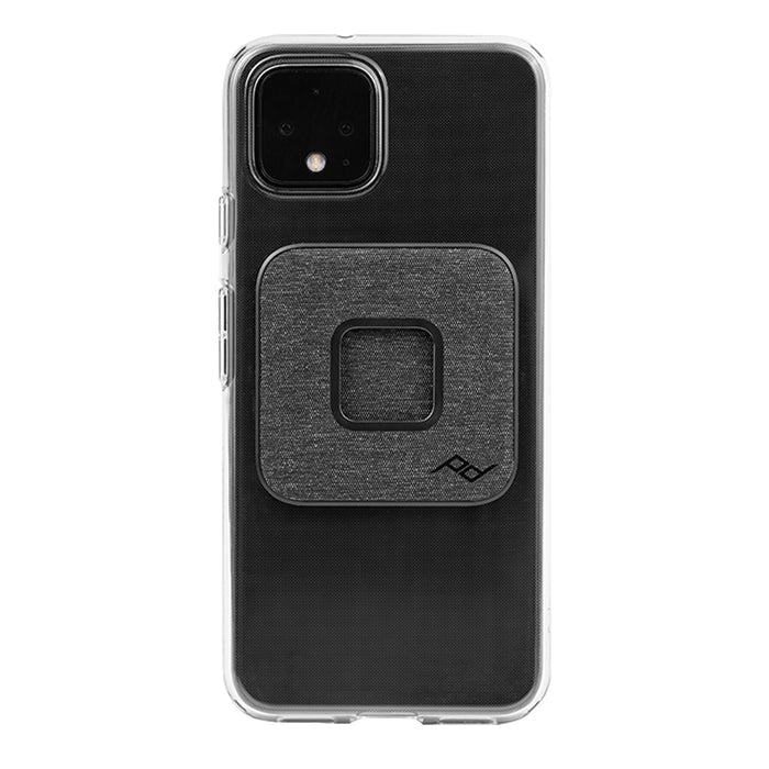 Peak Design Universal Phone Adapter installed on the back of a clear iPhone case.