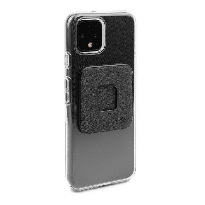 Alternate view of the Peak Design Universal Phone Adapter installed on the back of a clear iPhone case.