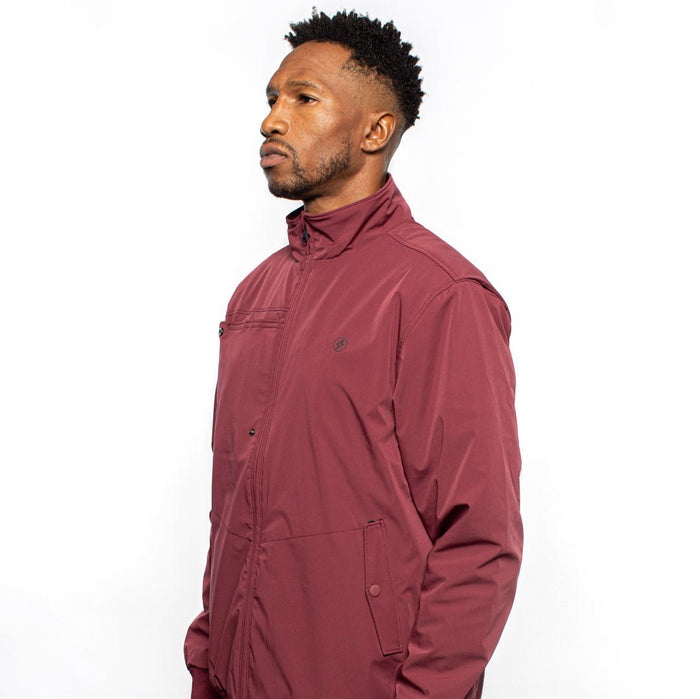 Side view of male model wearing Royce Harrington Jacket in burgundy colorway. @color_burgundy