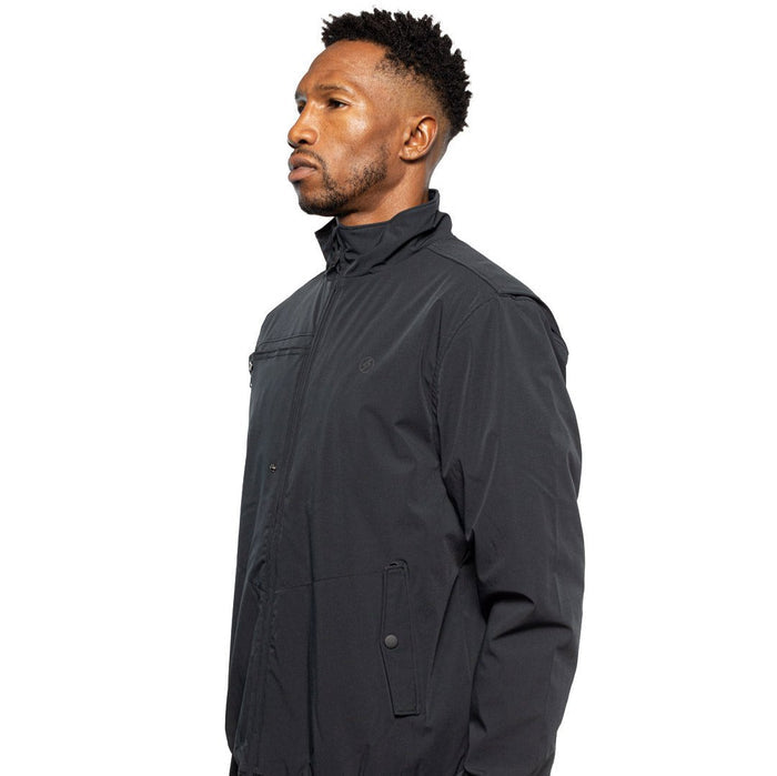 Side view of Male model wearing Royce Harrington Jacket in black colorway. @color_black