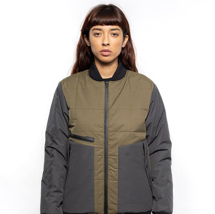 Female model wearing Sipes Varsity Jacket in dark fatigue colorway. @color_dark fatigue