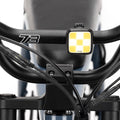 Knog light mounted on front handlebar. Studio shot.