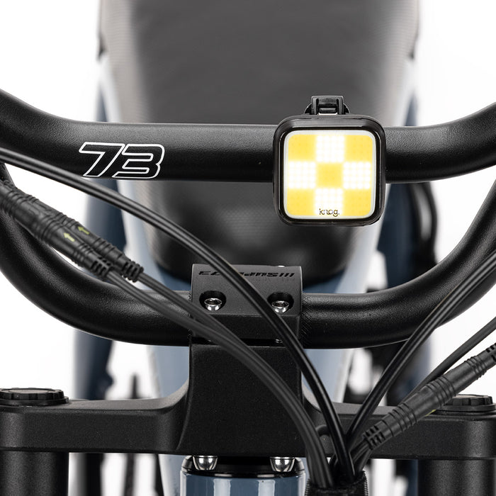 Knog light mounted on front handlebar. Studio shot.