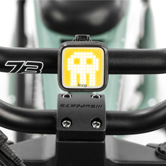 Skull light mounted on bike with white background