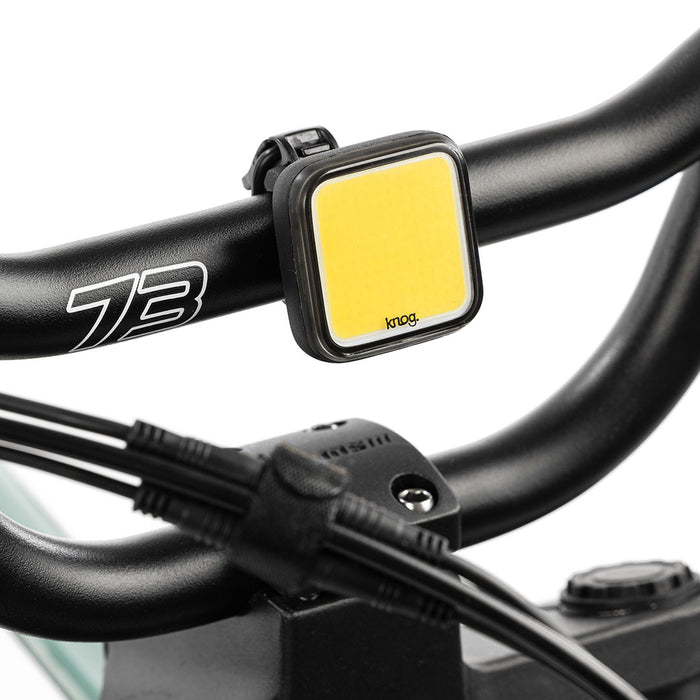 Skull light mounted on bike with white background