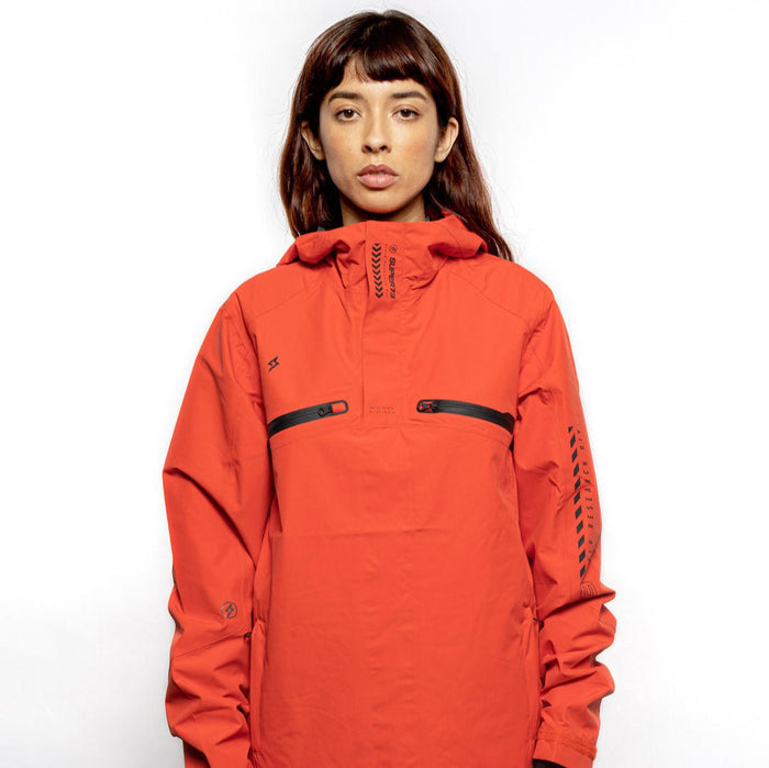 Female model wearing Vale Packable Anorak in blood orange colorway. @color_blood orange